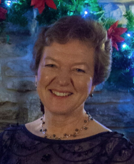Rev'd Pippa Soundy smiling at a festive gathering